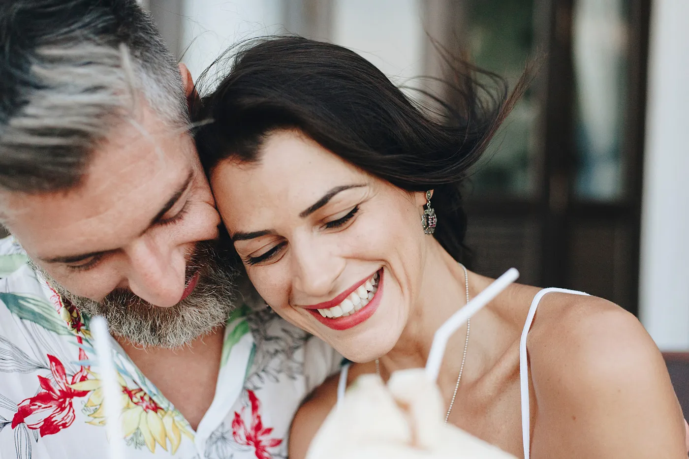 Smiling middle-aged couple embracing outdoors