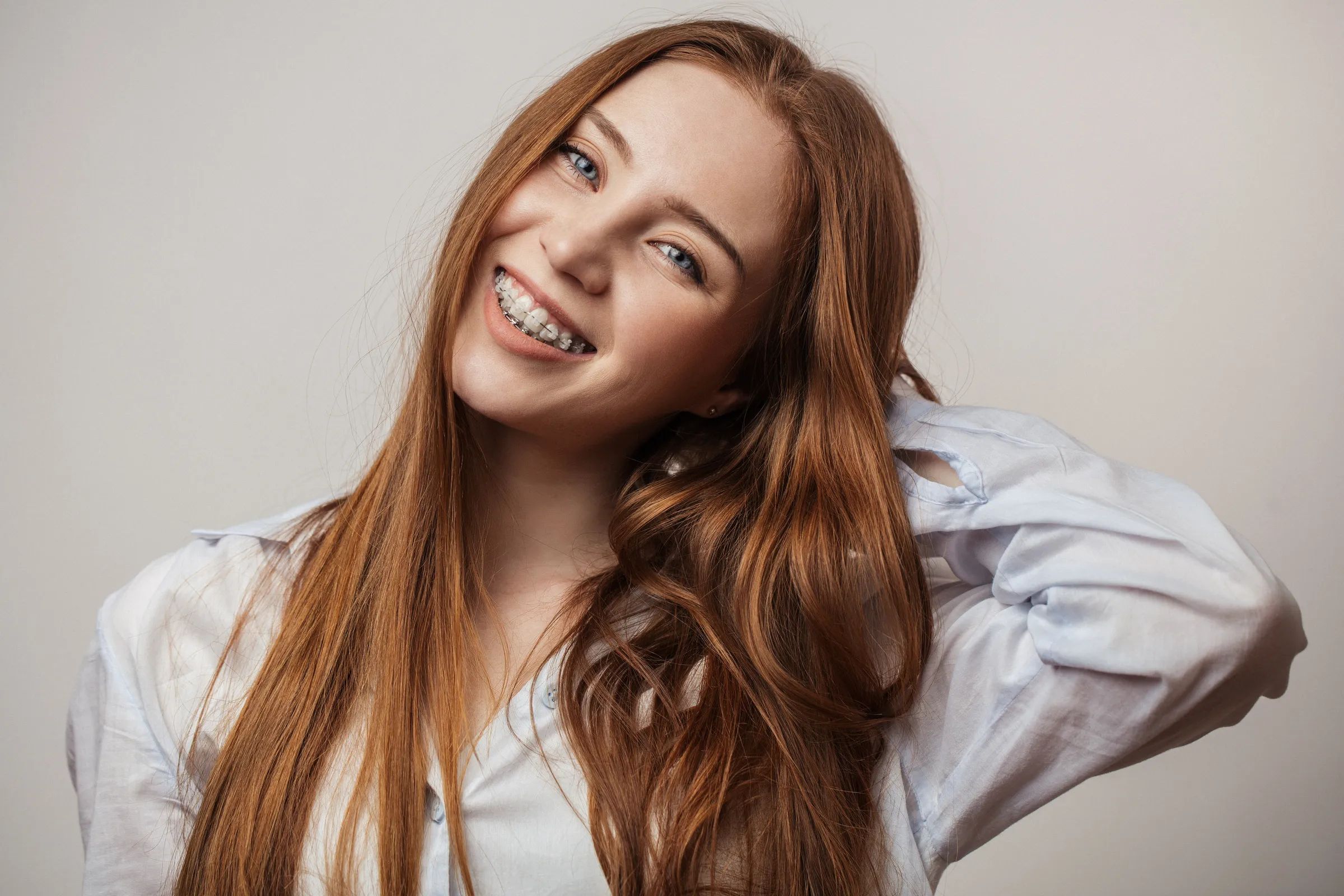 Smiling woman with long red hair