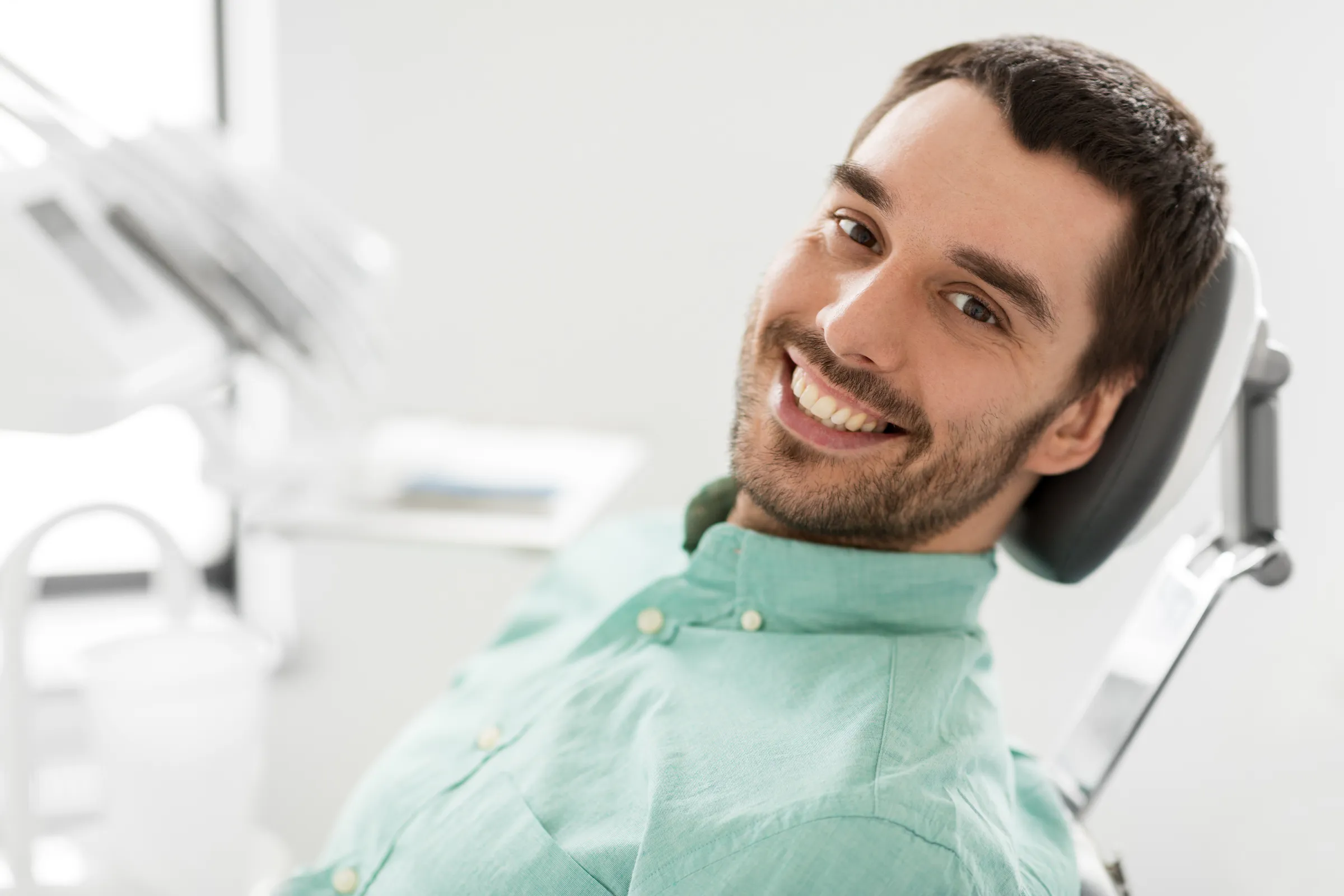 Man smiling in a dental chair