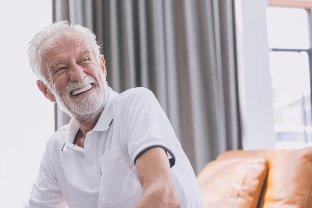 Smiling older man with a white beard