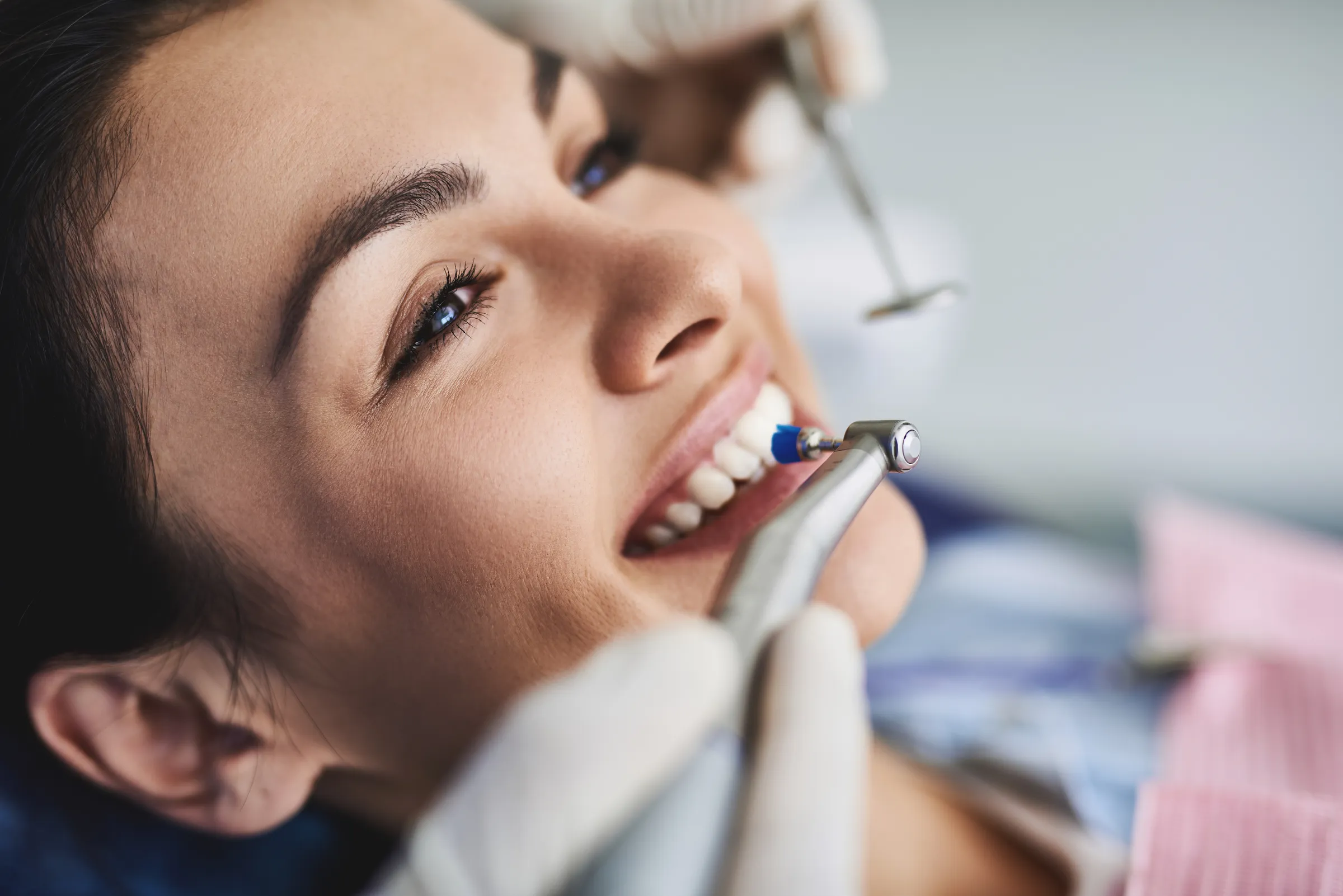 Woman having her teeth polished