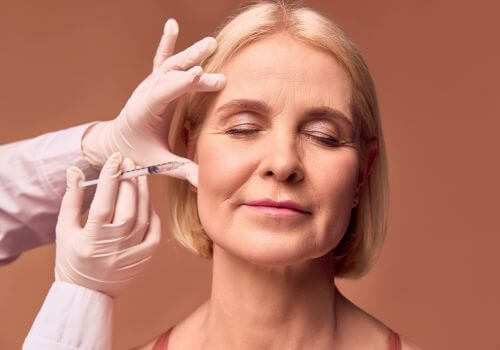 Woman getting botox for TMJ treatment