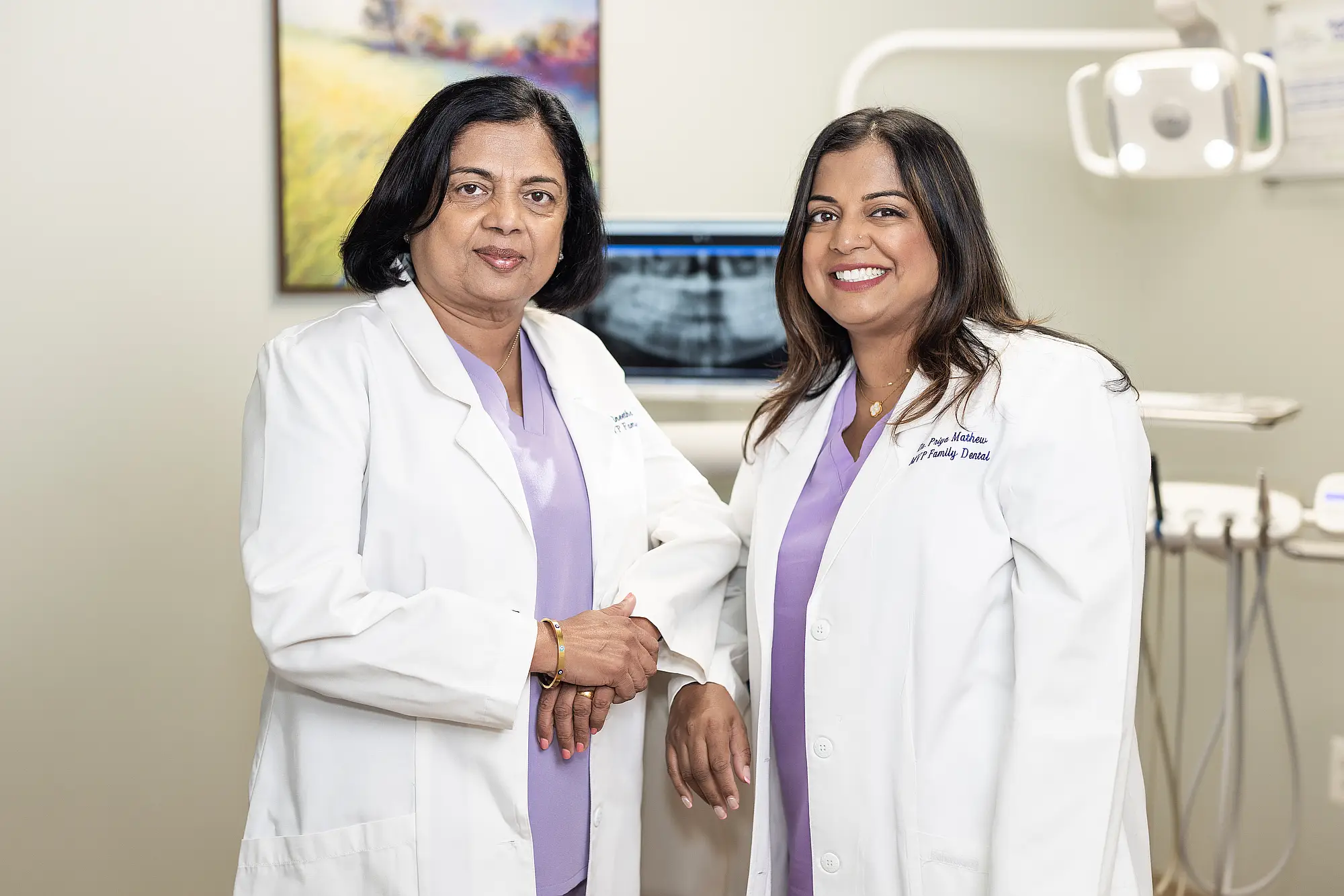 Dr. Vineetha Thomas and Dr. Priya Mathew together in a treatment room