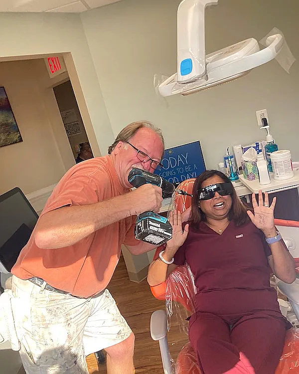 A patient joking with a team member in the treatment room