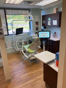 Treatment room with a window, chairside monitor and dental chair
