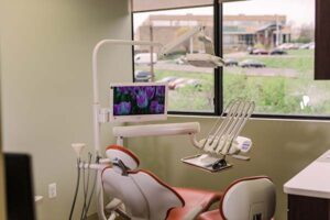 Operatory with a wide window and a monitor mounted at the chair