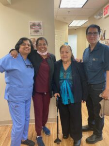 Five members of the team standing together in the office