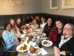 The MVP Family Dental team together at a restaurant table