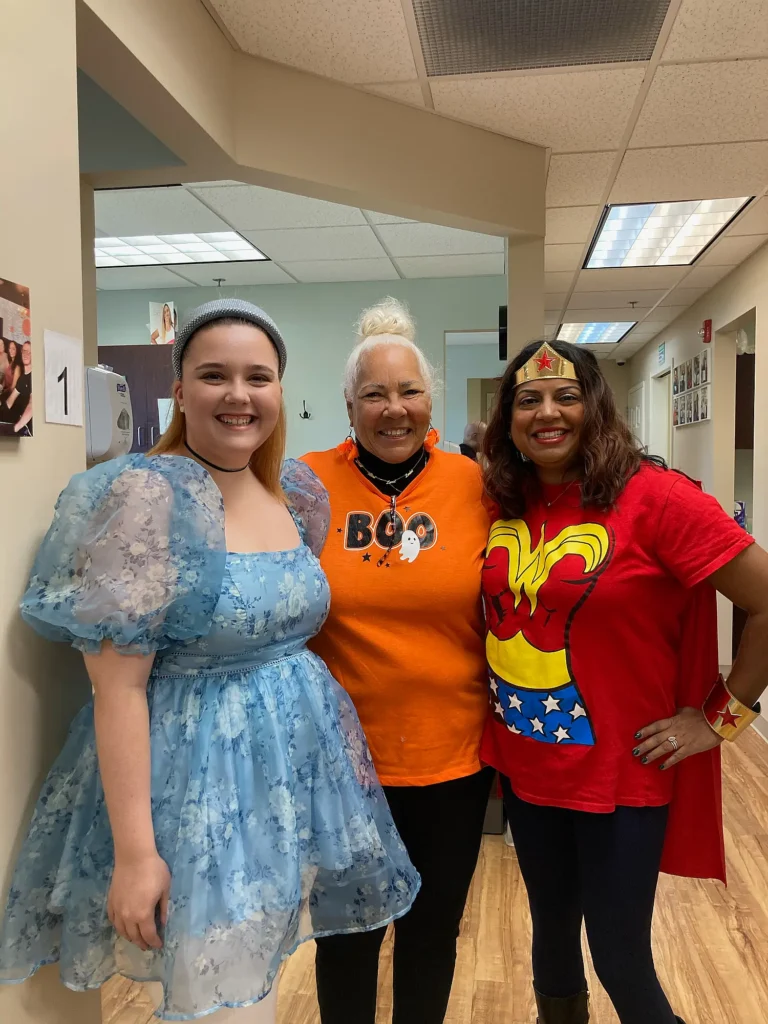 MVP Family Dental team and patient dressed in Halloween costumes including Wonder Woman