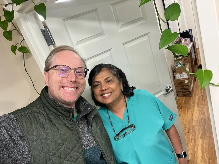 Smiling patient taking a selfie with a dental team member at MVP Family Dental