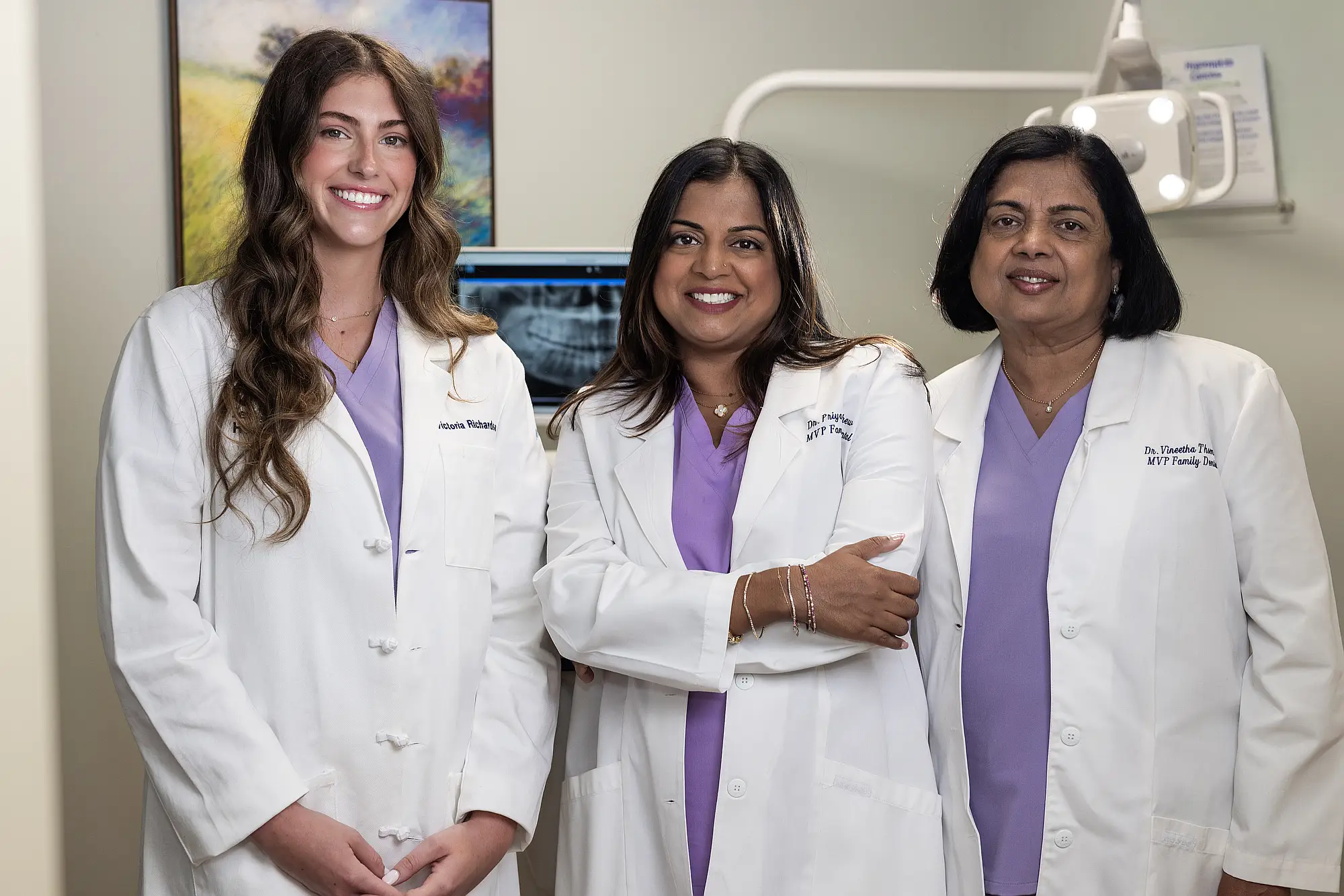 The three MVP Family Dental dentists in a treatment room