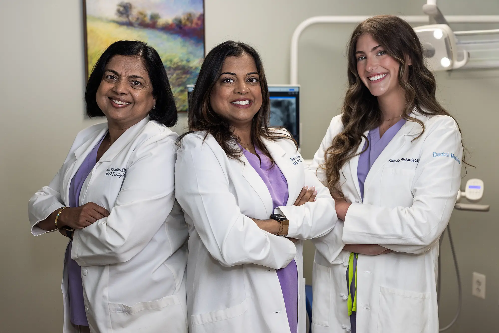 The three MVP Family Dental dentists together in a treatment room