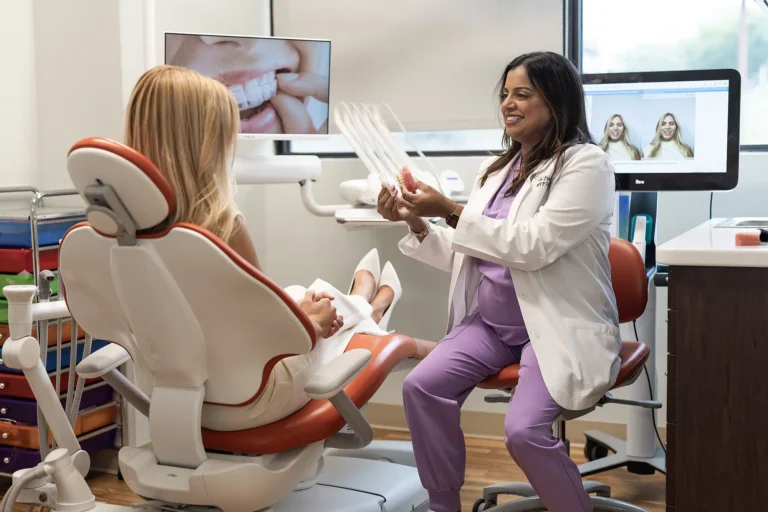 Dr. Priya Mathew reviewing a smile scan with a patient