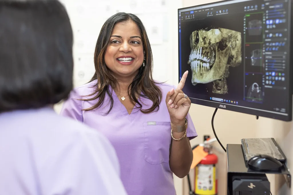 Dr. Priya Mathew discussing a 3D scan with a colleague