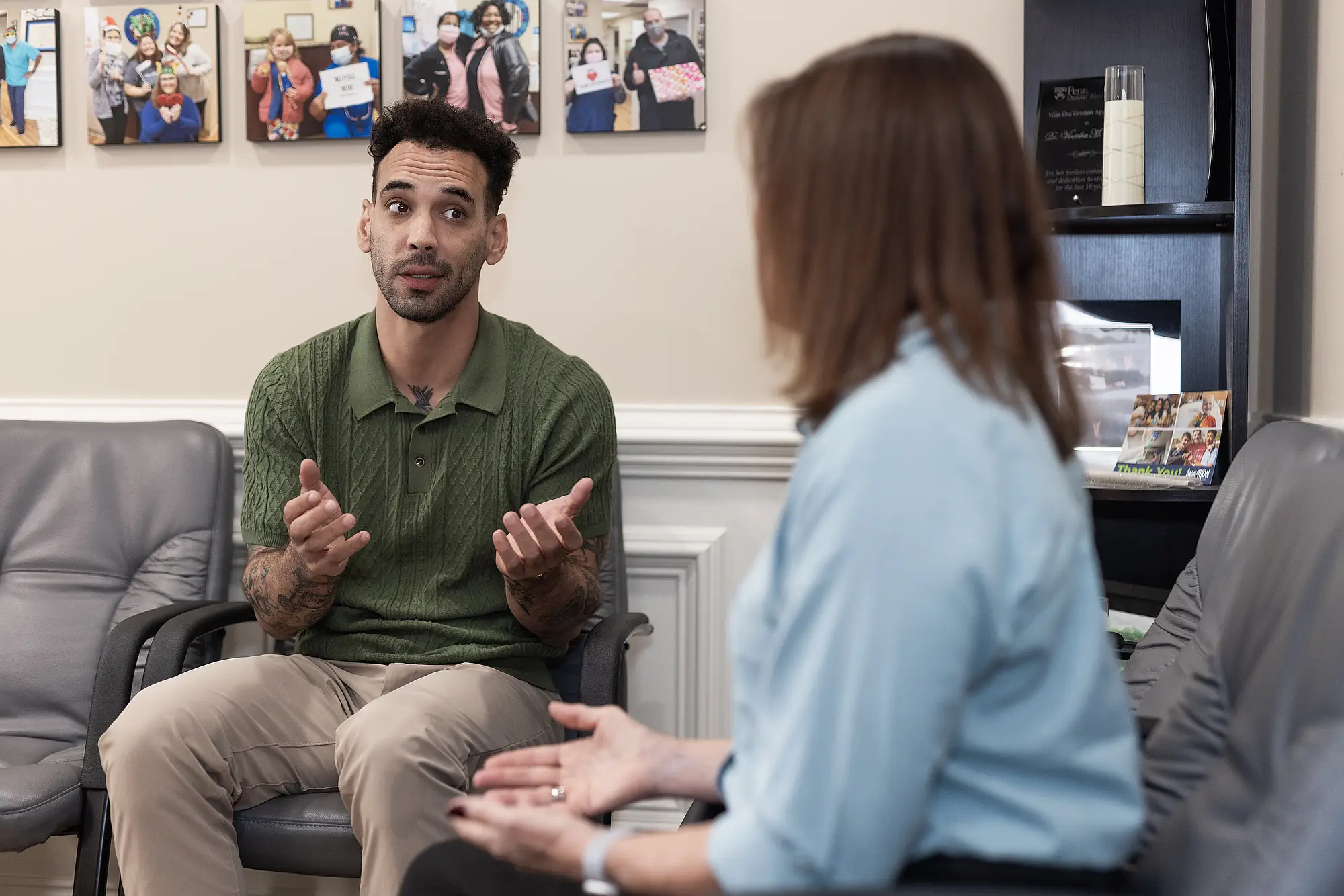 Patient in conversation with a team member in reception