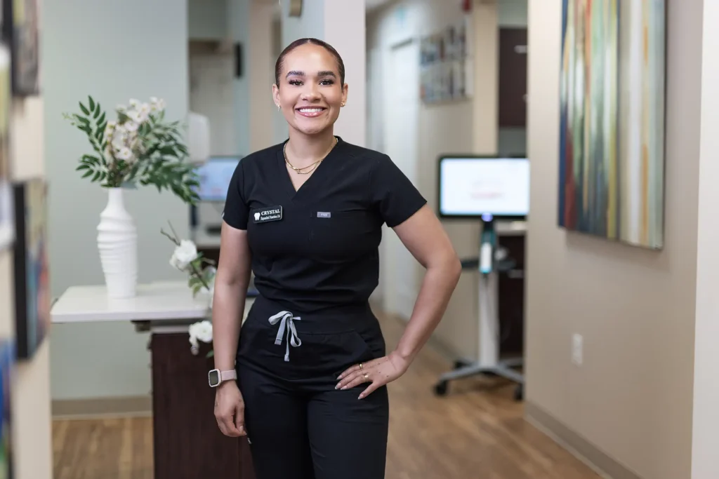 Smiling MVP Family Dental team member in scrubs