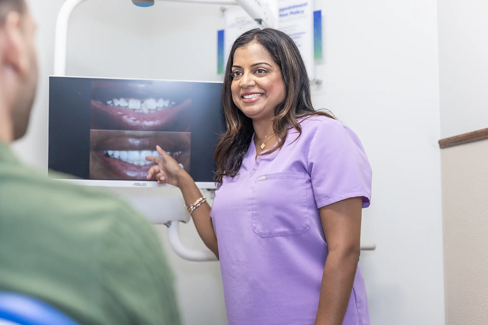 Dr. Priya Mathew presenting a patient's smile photographs