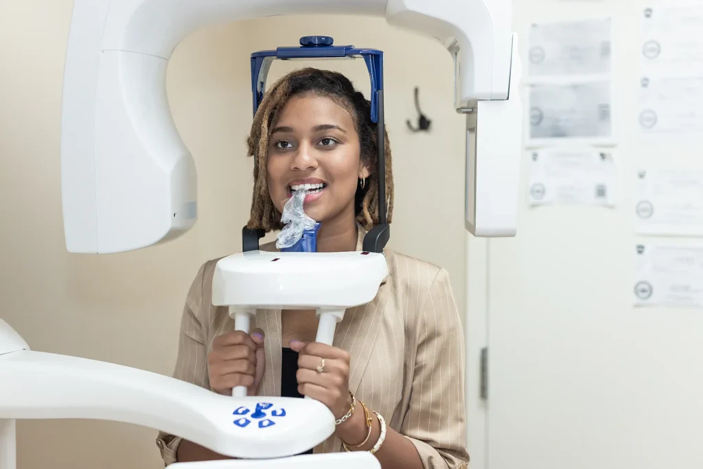 Patient positioned in a panoramic X-ray machine